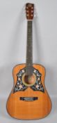 A K440 acoustic guitar, with floral back mount and pearlised pegs,