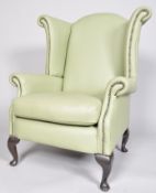 A 20th century wingback armchair,