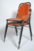 A pair of tubular chairs with black painted frames, and tan leather seats and backs, 20th century,