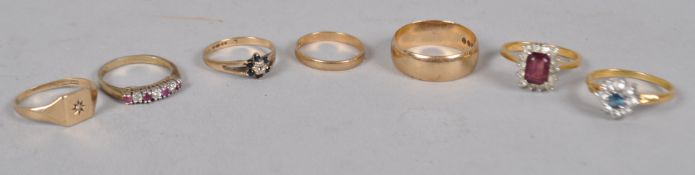 A 9ct gold 7.5mm domed flat wedding ring, hallmarked for London, together with six other rings, 9.