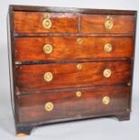 A George III mahogany chest of two short and three long graduated drawers,