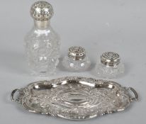 A silver plated pin tray with of twin handled form, with repousse decoration