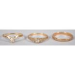 A collection of three rings to include: A hallmarked 9ct gold 2.