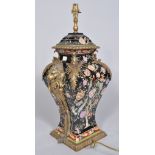 A Chinese porcelain famille noir style brass mounted lampbase,