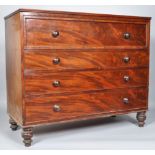 A Victorian mahogany secretaire chest of four graduated drawers on turned legs,