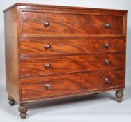 A Victorian mahogany secretaire chest of four graduated drawers on turned legs,