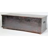 A pine blanket box of rectangular form, with hinged top and handles painted black overall,