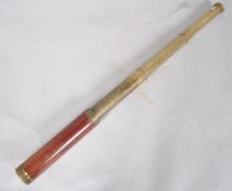 A late 19th century brass and mahogany three draw telescope,