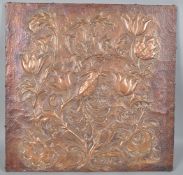 A hand hammered and embossed copper panel,