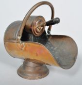 A late 19th century copper coal scuttle, with shovel,