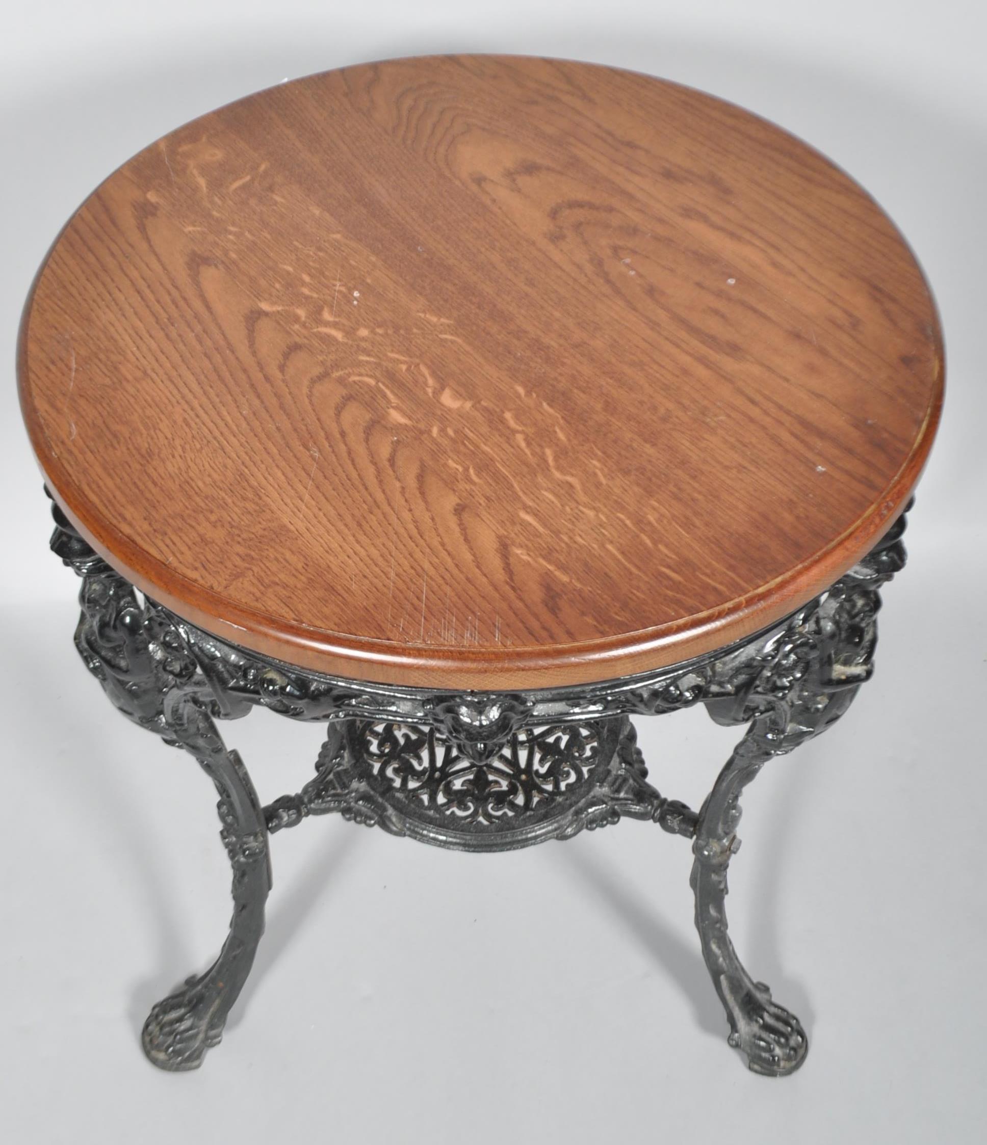 A cast iron pub table, the circular oak top above moulded frieze, cast with figures of Britannia, - Image 2 of 2