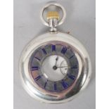 A full hunter mechanical pocket watch. White circular dial with roman numerals.