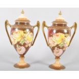 A pair of Continental porcelain oviform two handled vases and covers, circa 1900,