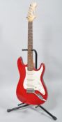 A Gear 4 Music electric guitar, with red and white body,
