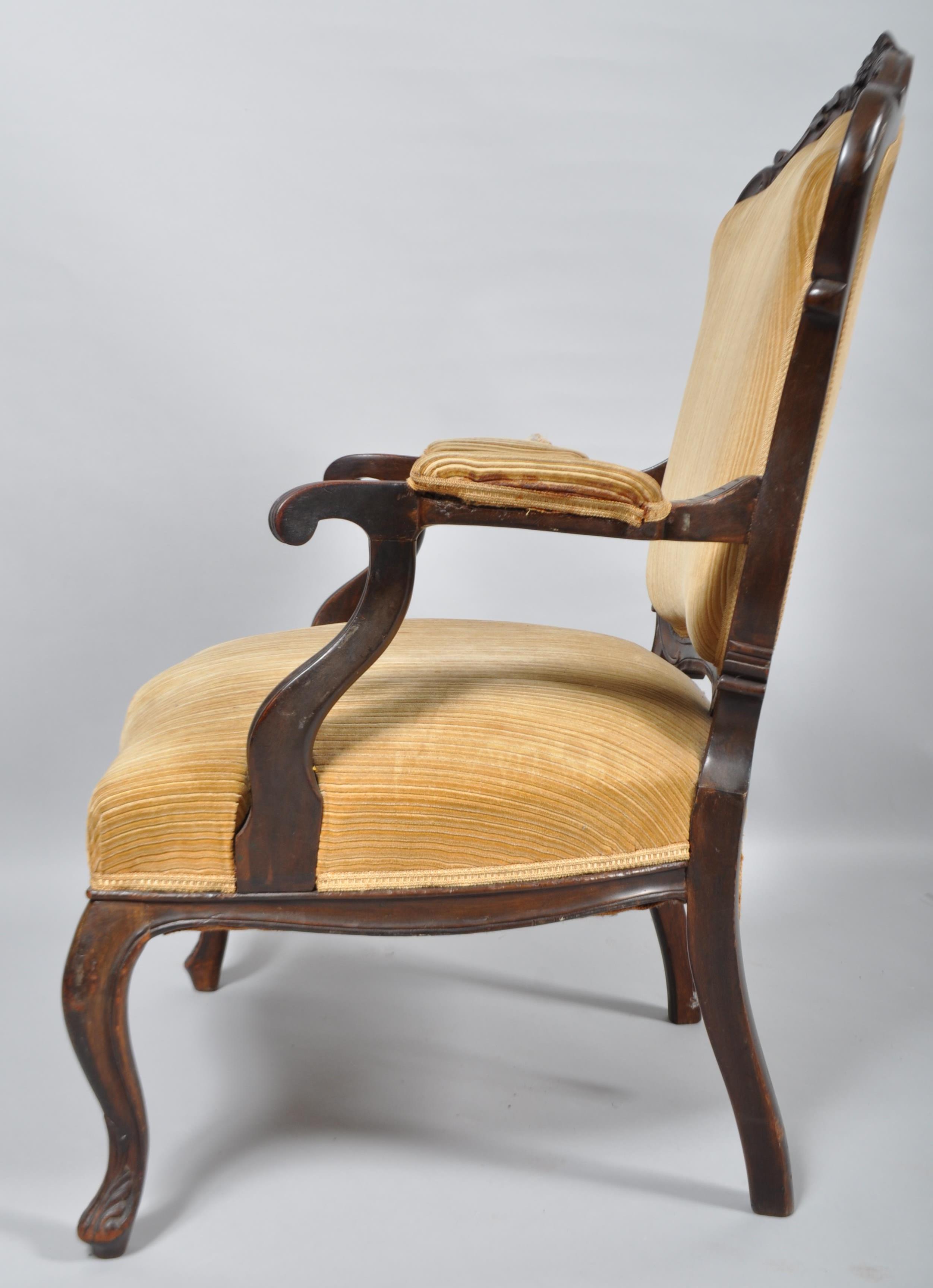 A 19th century Victorian mahogany elbow chair having carved decoration to backrest and upholstered - Image 2 of 2