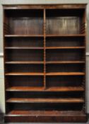 A large mahogany bookcase, early 19th century, with carved reeded borders,