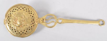 A Victorian brass warming pan,