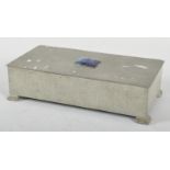 An Arts and Crafts hammered pewter rectangular tobacco box and cover,