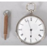 A sterling silver open face pocket watch. White dial with Roman numeral markings. Engraved case.