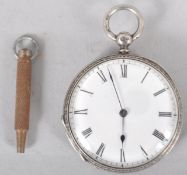 A sterling silver open face pocket watch. White dial with Roman numeral markings. Engraved case.