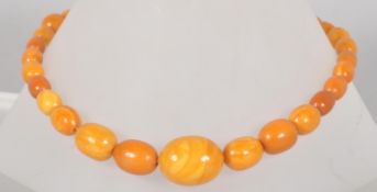 A single strand of graduated butterscotch beads. 25 Inch length.