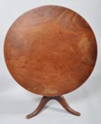A late 18th century mahogany tilt top supper table, the circular top above turned stem,
