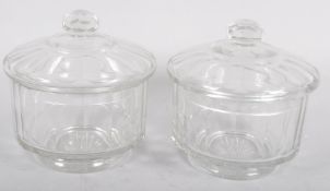 A pair of Victorian cut glass bowls and covers, mid 19th century, each of panelled form,
