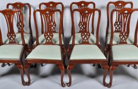 A set of eight mahogany reproduction George III style dining chairs,