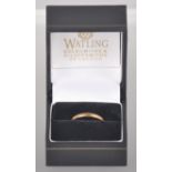 A yellow metal 2.0mm D shape wedding ring. Hallmarked 22ct gold, London, 1937.