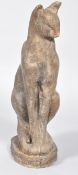 A resin sculpture of a Siamese cat, naturalistically modelled and painted to simulate stone,
