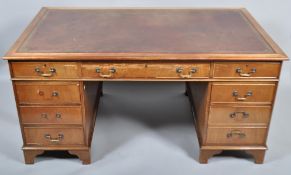 A 20th century twin pedestal mahogany desk,