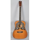 A K440 acoustic guitar, with floral back mount and pearlised pegs,