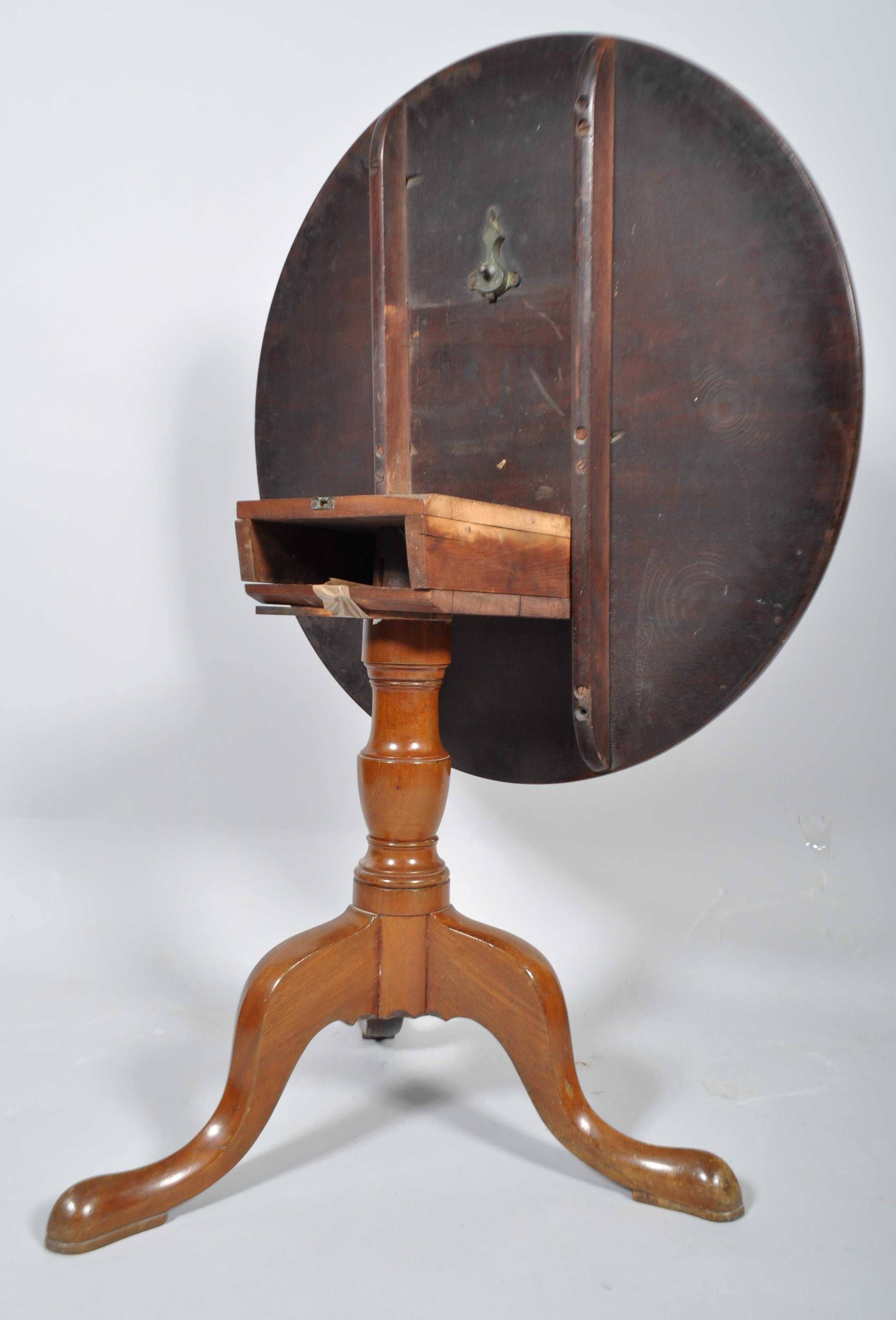 A mahogany tripod tilt-top tea table, with circular top above a baluster stem and tripod legs, - Image 3 of 3