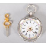 A silver 0.935 key would open face pocket watch. White ceramic dial with floral embellishments.
