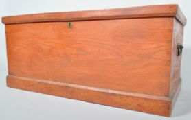 A late Victorian stained pine trunk travelling trunk, with two handles,