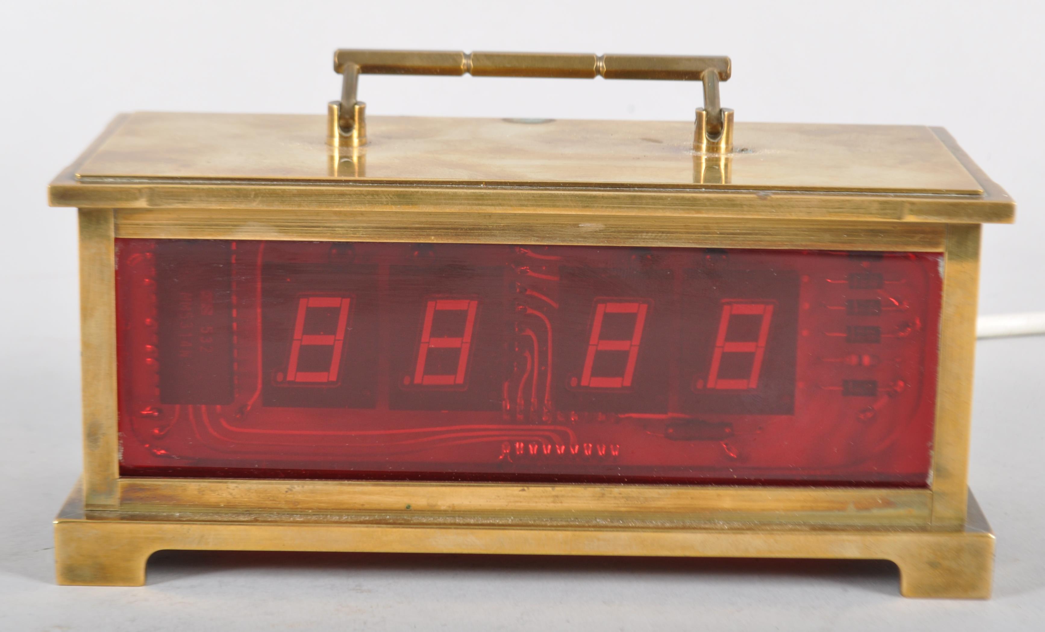 An early brass, scratch built digital clock, in the design of a carriage clock,