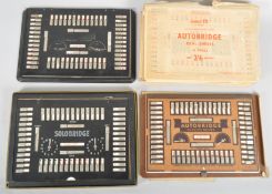 Three vintage Autobridge playing boards with a collection of deal sheets