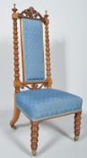 A Victorian walnut nursing chair, with high back and stuff-over seats,