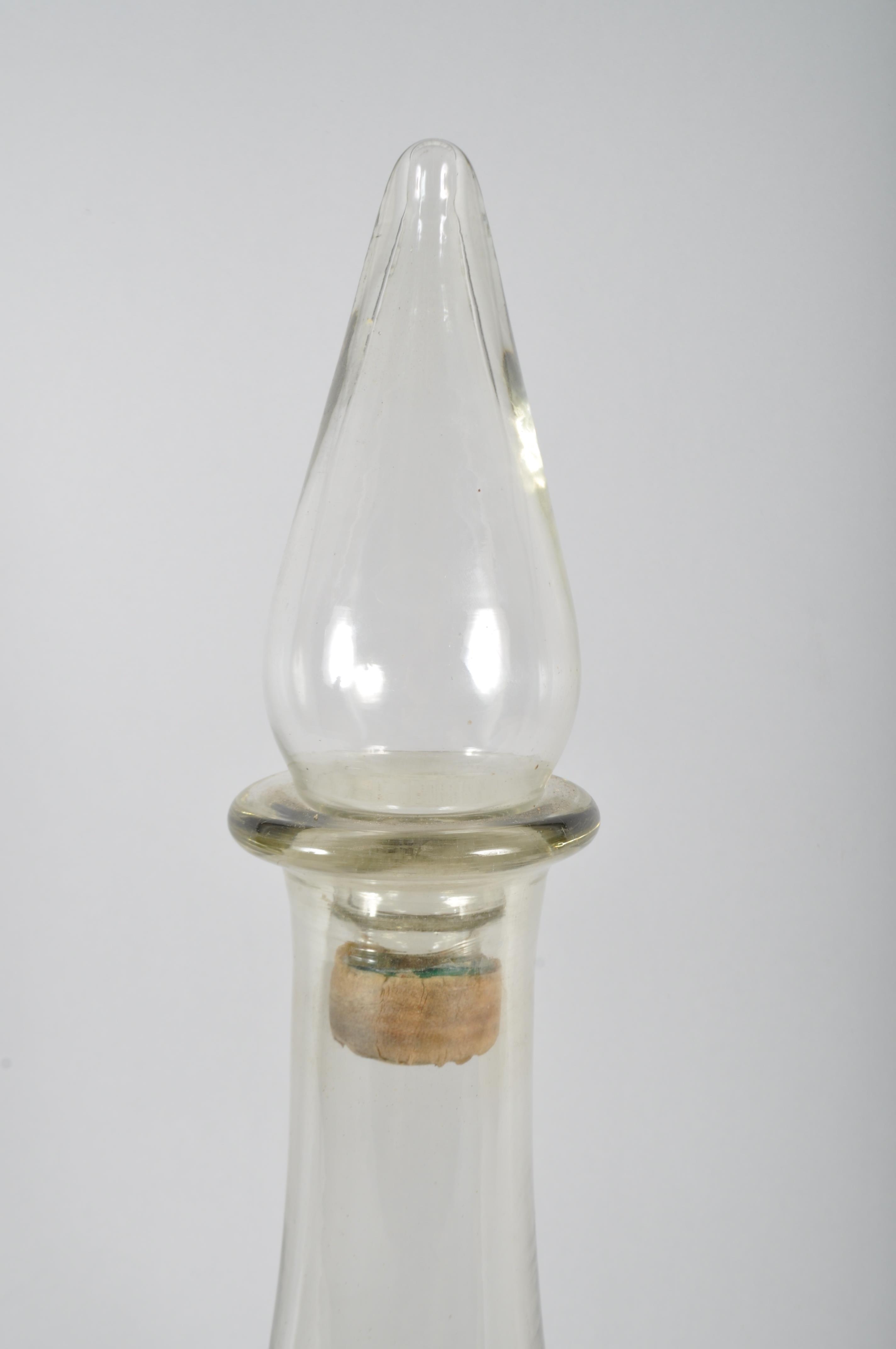 A large glass apothecary bottle an stopper, circa 1900, of baluster form, with spire stopper, - Image 2 of 2