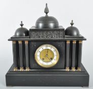 A Victorian slate mantel clock, the white chapter ring with Arabic numerals,