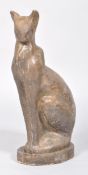 A resin sculpture of a Siamese cat, naturalistically modelled and painted to simulate stone,