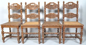 A set of four 19th century Continental oak chairs with carved backs,