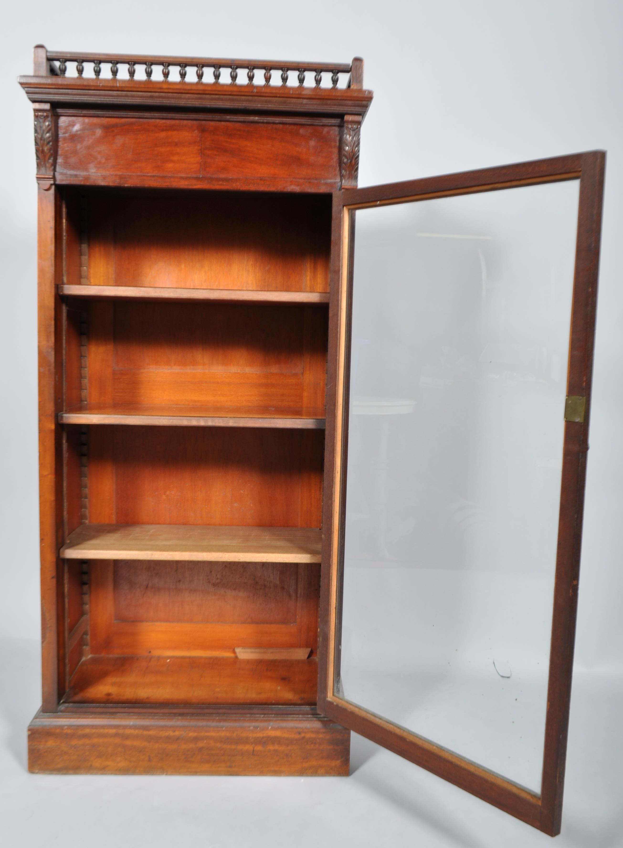 A late Victorian mahogany glazed bookcase, the balustraded top above acanthus cappings, - Image 3 of 3