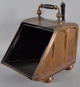 A late 19th century copper coal scuttle with fitted liner and original shovel,