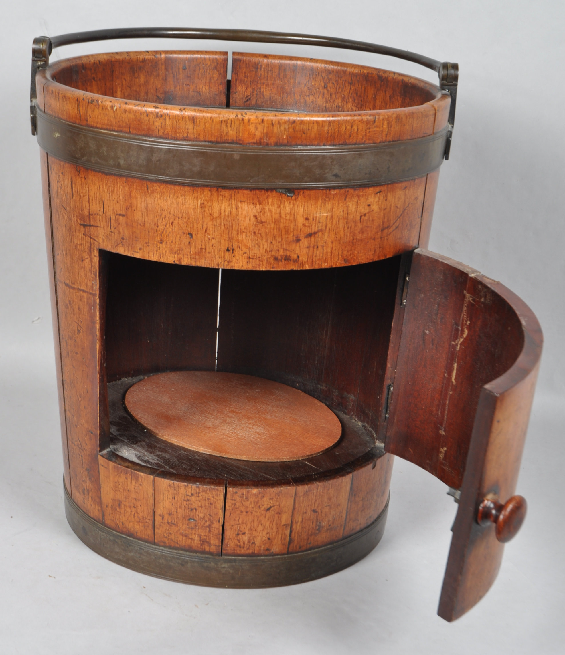 An early 19th century mahogany pot cupboard in the form of a large brass bound coopered peat bucket, - Image 2 of 2