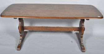 A late 20th century Ercol beech and elm Grand Windsor dining table,