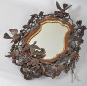 A carved wood and parcel gilt mirror frame by George S Stevens, 1861,