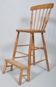 An elm and beech clerk's chair, with spindle back and step,