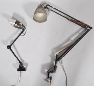 A mid 20th century black painted desk/work top mounted anglepoise lamp, with a vice attachment,