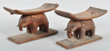 A pair of carved African hardwood neck rests possible Benin from Nigeria 16cm H 27cm W 11cm D